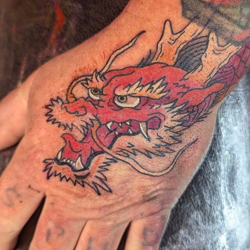 Not only did I do my first traditional Japanese dragon today but I also did my first hand tattoo. Doing this head was more fu...