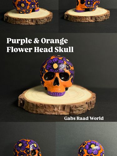 Purple & Orange Flower Head Skull 🍊💀🪻

Hand painted Ceramic Skull. Great way to add some colorful edge to any desk, table or ...
