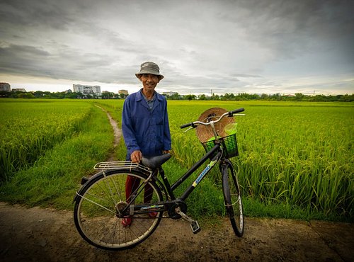 This lovely rice farmer gladly posed for me while he was out checking his crops this morning