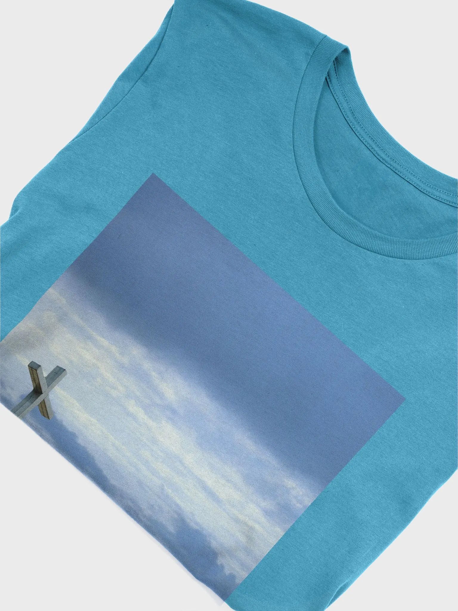 A cross standing against a dramatic sky with layers of clouds t-shirt product image (7)