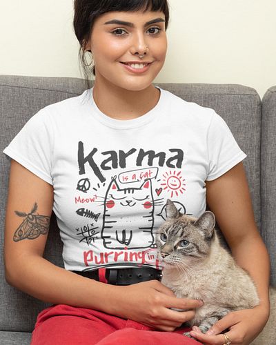 Karma is a cat… purring in your lap, living its best life—just like you should. 😼✨

This t-shirt is for those who know that w...