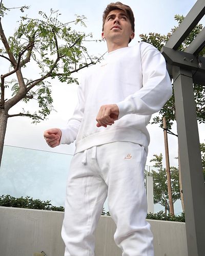 now available in season 2 the white ‘drip’ sweat set, premium cotton, embroidered, orange on white