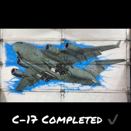 Well there’s always a first for everything, here is a C-17 and an F-22 Raptor airbrushed on a set of garage doors in the shop...