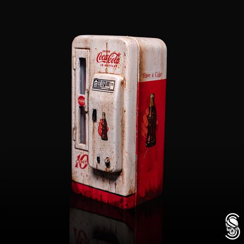 The little metal Coca-Cola cooler from the AMT 1955 Cameo truck kit. It's die-cast so its low on physical detail. 
.
Twitch.t...
