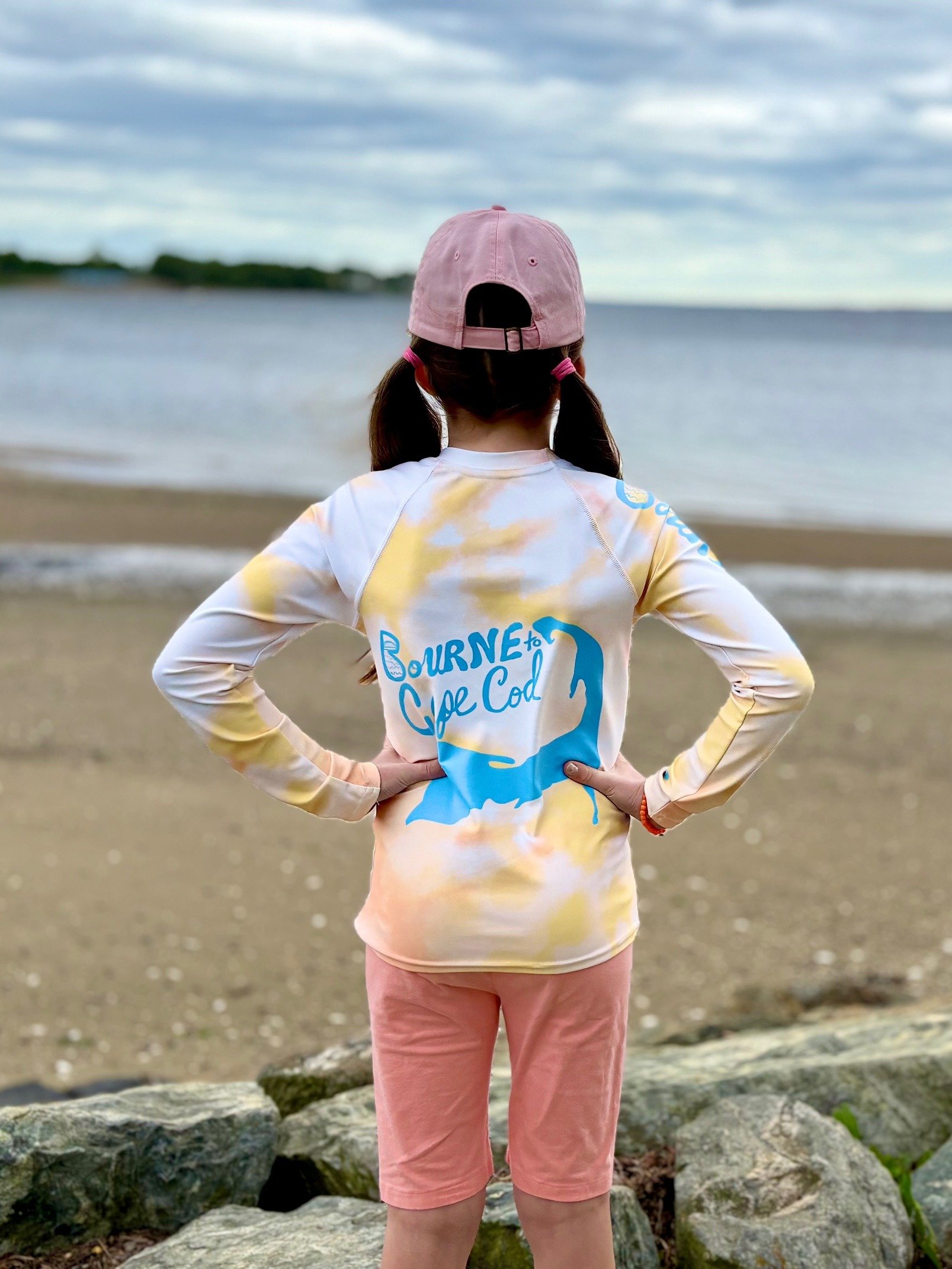 YOUTH | Rash Guard | BRN.2C.C.™ Front Graphic | BOURNE to Cape Cod™ Sleeve & Back Logo | Coastal Swim Shirt for Kids | UV Protection Activewear | Blue Logo on Orange Tie-Dye product image (2)