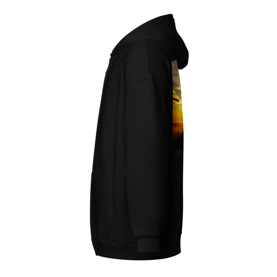 Large cross silhouetted against a dramatic sunset, vibrant hues of yellow, orange, dominate the sky, with clouds and distant mountains Hoodie product image (3)