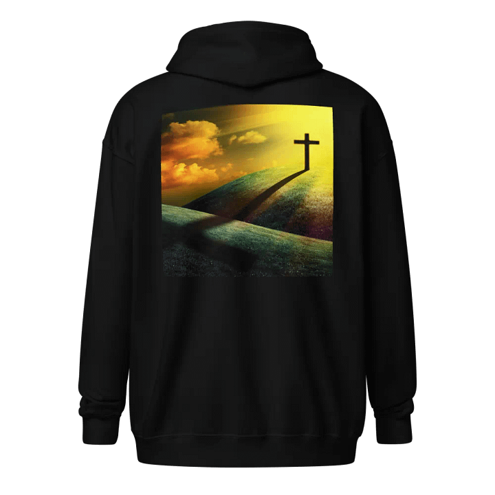 A cross standing prominently on a grassy hill, with a vivid, dramatic background Hoodie product image (1)