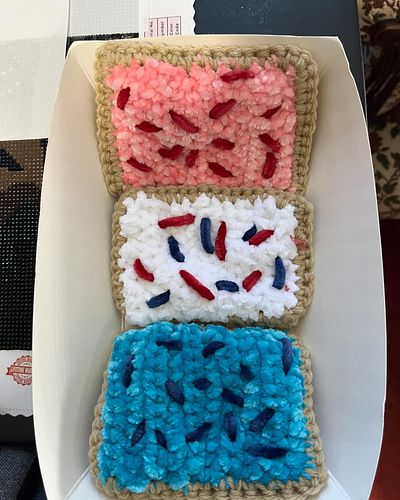 Did you guess breakfast pastry crinkle fidget toy?

These three beauties have some crinkle paper inside and two types of yarn...