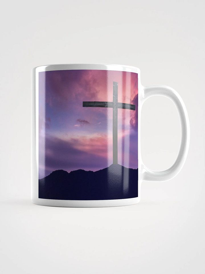 Wooden cross standing on a hill, silhouetted against a vibrant & colorful sky & a cross with a vivid, dramatic background Mug product image (1)