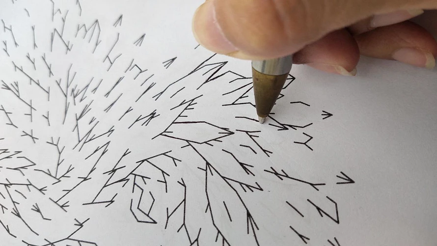 an close-up image of hand carefully drawing line