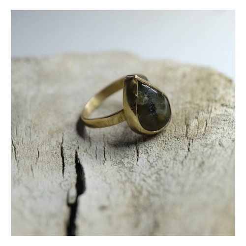 Unique, handmade teardrop labradorite set in brass. Size 5.
A feldspar mineral renowned for its striking optical phenomenon c...
