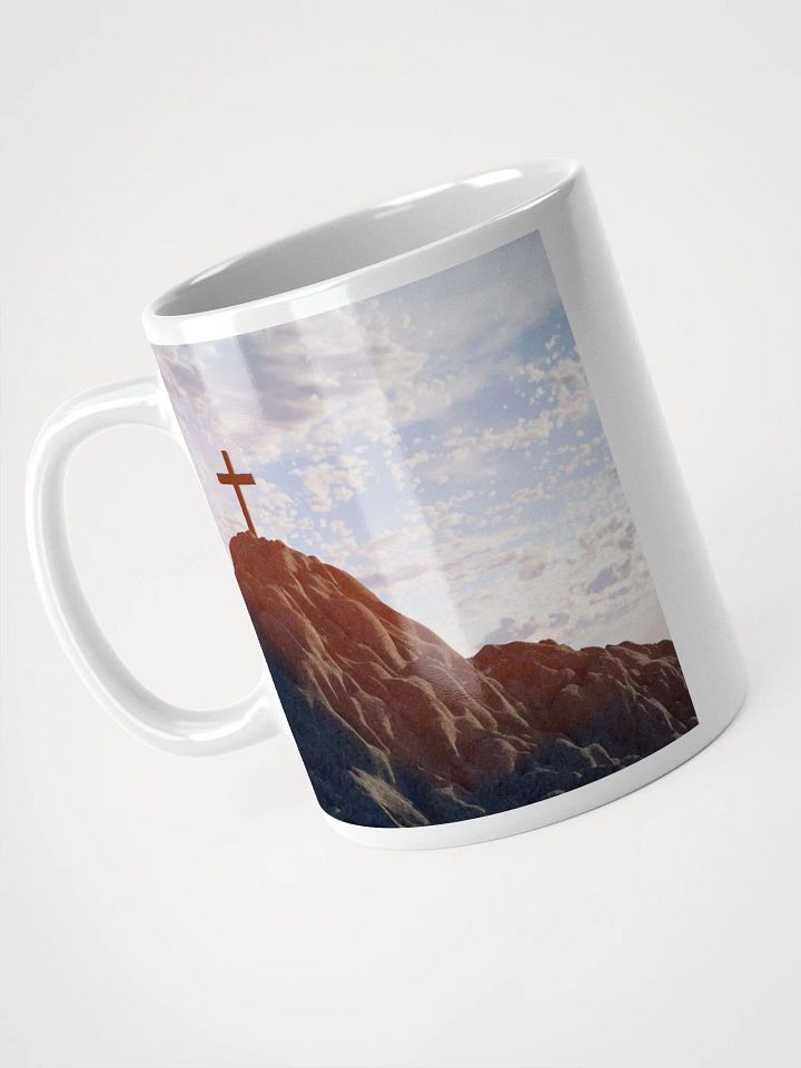 Wooden cross standing atop a rocky hill or mountain, under a sky filled with soft clouds & warm sunlight & cross standing against a dramatic sky with layers of clouds Mug product image (2)