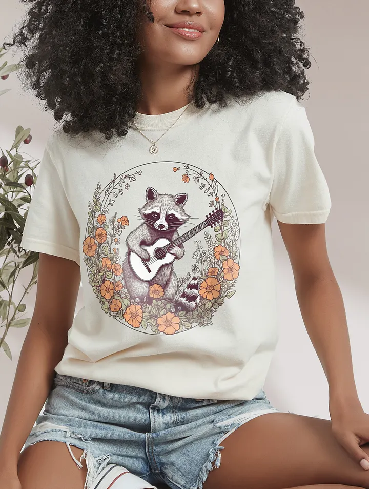Vintage-Style Raccoon with a Guitar in a Field of Wildflowers and Daisies T-Shirt | Cottagecore & Goblincore Shirt Design product image (10)