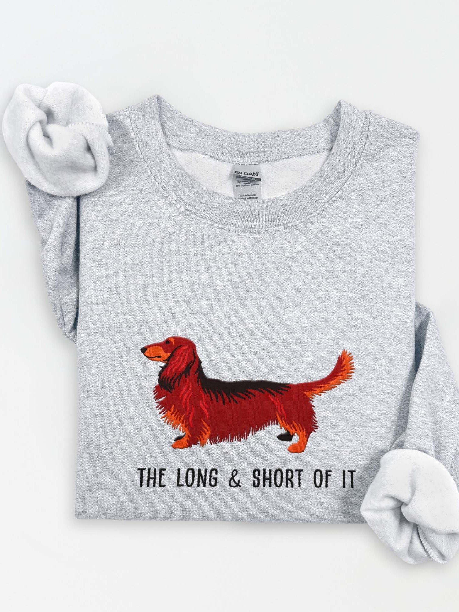The Long & Short of It Sweatshirt (Embroidered) of a Longhaired Dachshund(Red & Tan) product image (1)