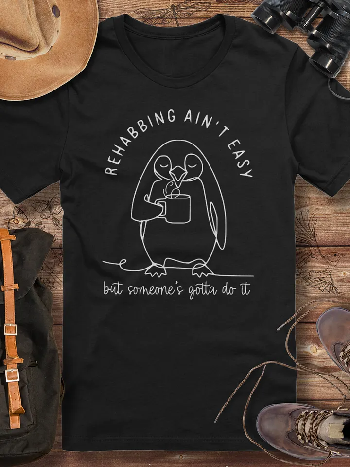 Funny penguin rescue tee, wildlife rehabber gift, rehabbing ain’t easy, animal carer gift, penguin lover tee, cute animal rescue, wildlife rehabber shirt, funny wildlife carer appreciation tshirt product image (1)