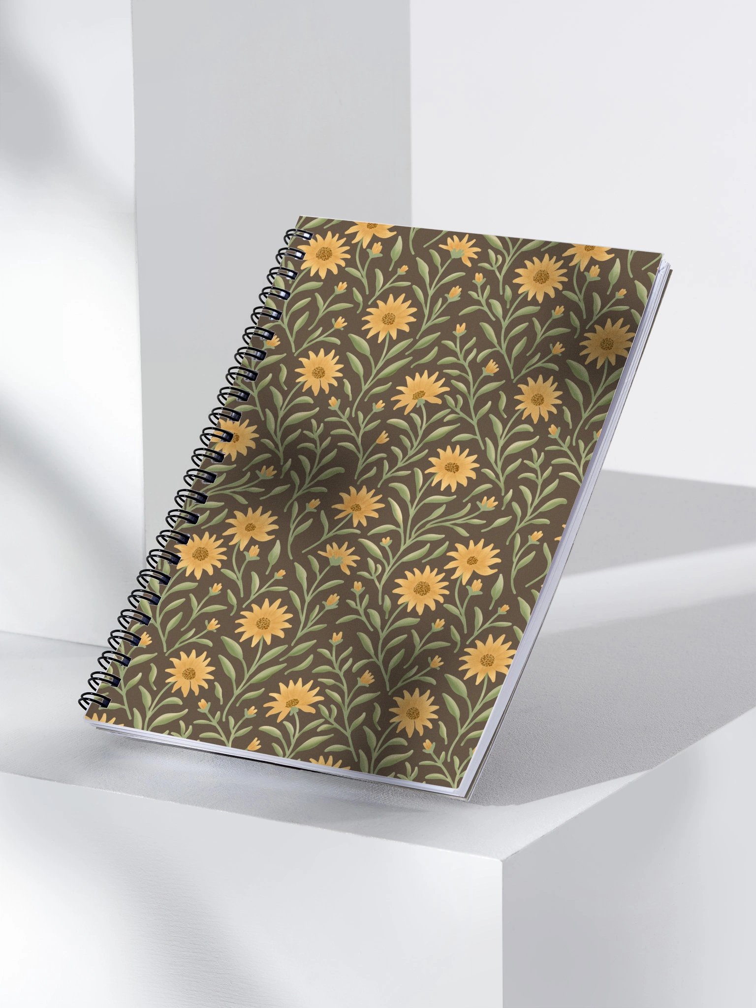 Golden field spiral notebook with floral design on dark background. Elegant botanical journal product image (1)