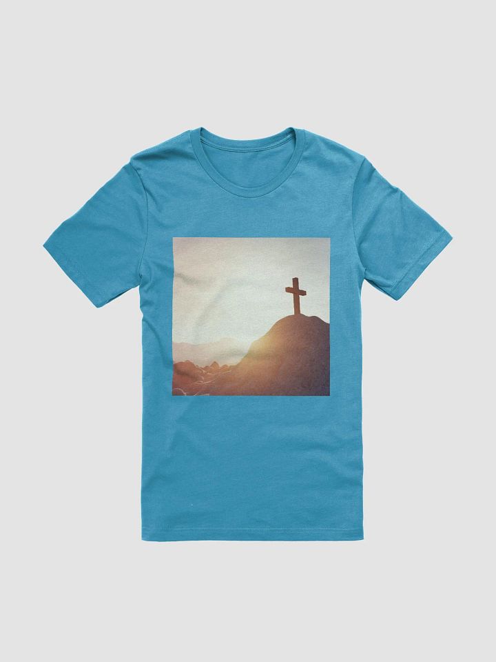 A cross placed on top of a rocky hill, bathed in the warm glow of a sunrise or sunset t-shirt product image (1)