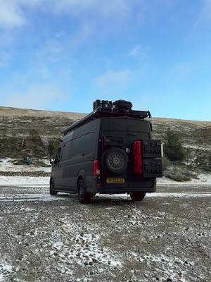 When the wind shakes the van but the view steals your breath. 🌨️🚐 #SnowySunset #vanlife 