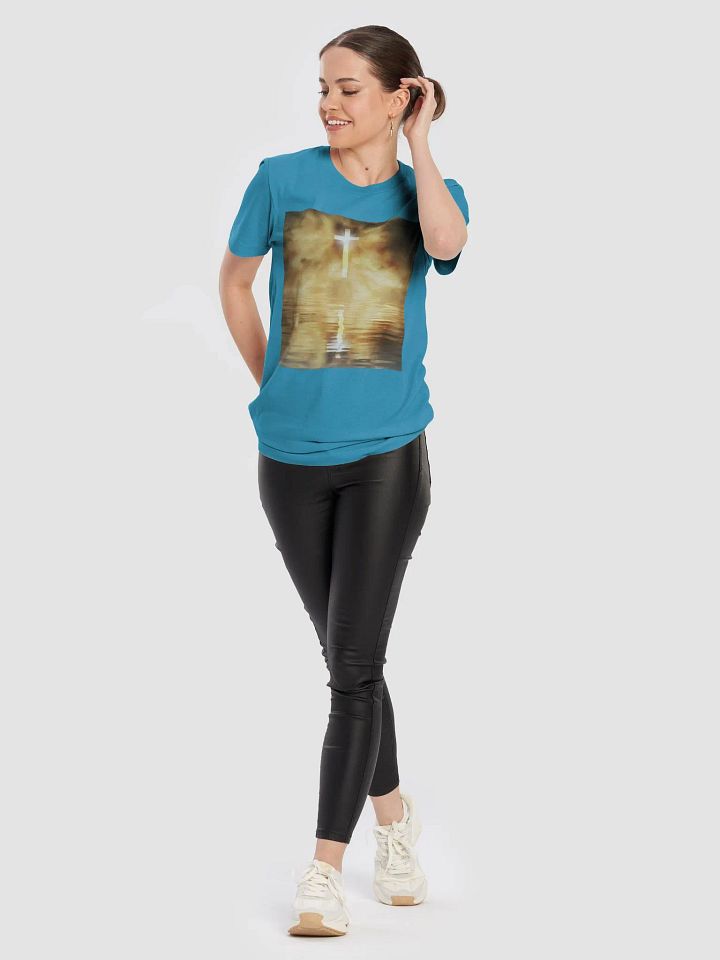Glowing cross illuminated by intense golden light, reflecting on calm water below t-shirt product image (2)
