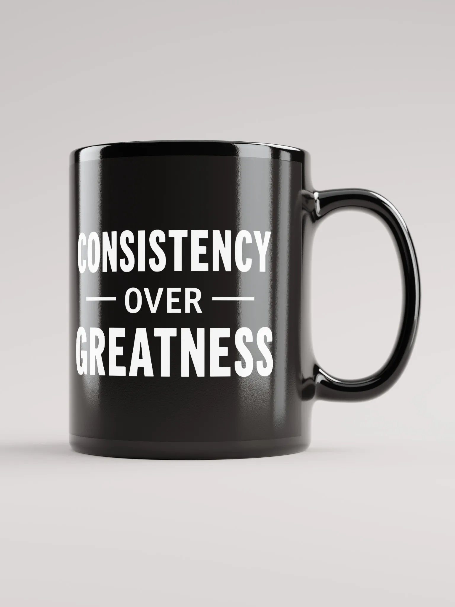 Unleash Your Inner Champion: The Rock’s Consistency Over Greatness Mug – Fuel Your Journey, One Sip at a Time product image (1)