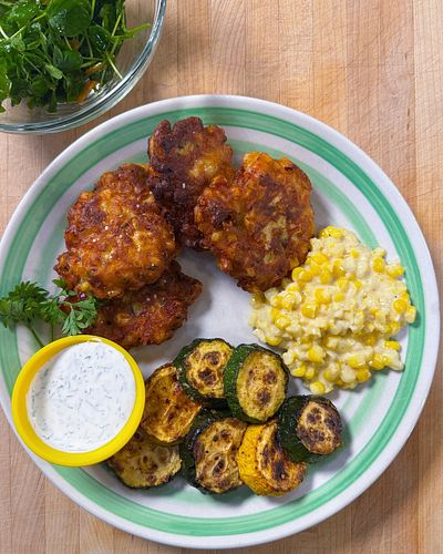 Corn will be served until everyone hates it. 🌽 Fair? I think so. Corn fritters, creamed corn, roasted zucchini, and dressed p...