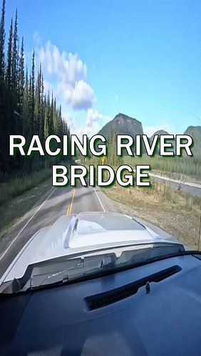 Grant crosses the Racing River Bridge, beautiful views, but he hates riding it on the bike! #RacingRiver #BCScenery #Mountain...