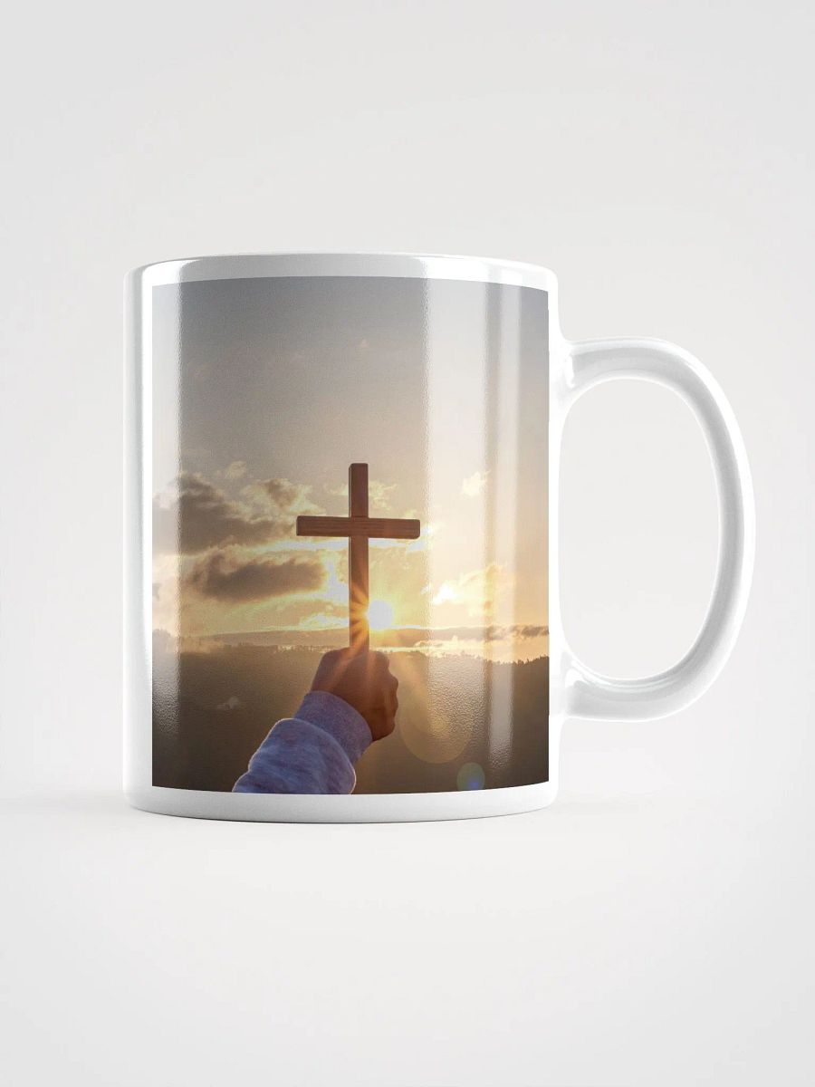 Cupped hands holding a glowing cross silhouette & Wooden cross being held up against the backdrop of a sunrise Mug product image (1)