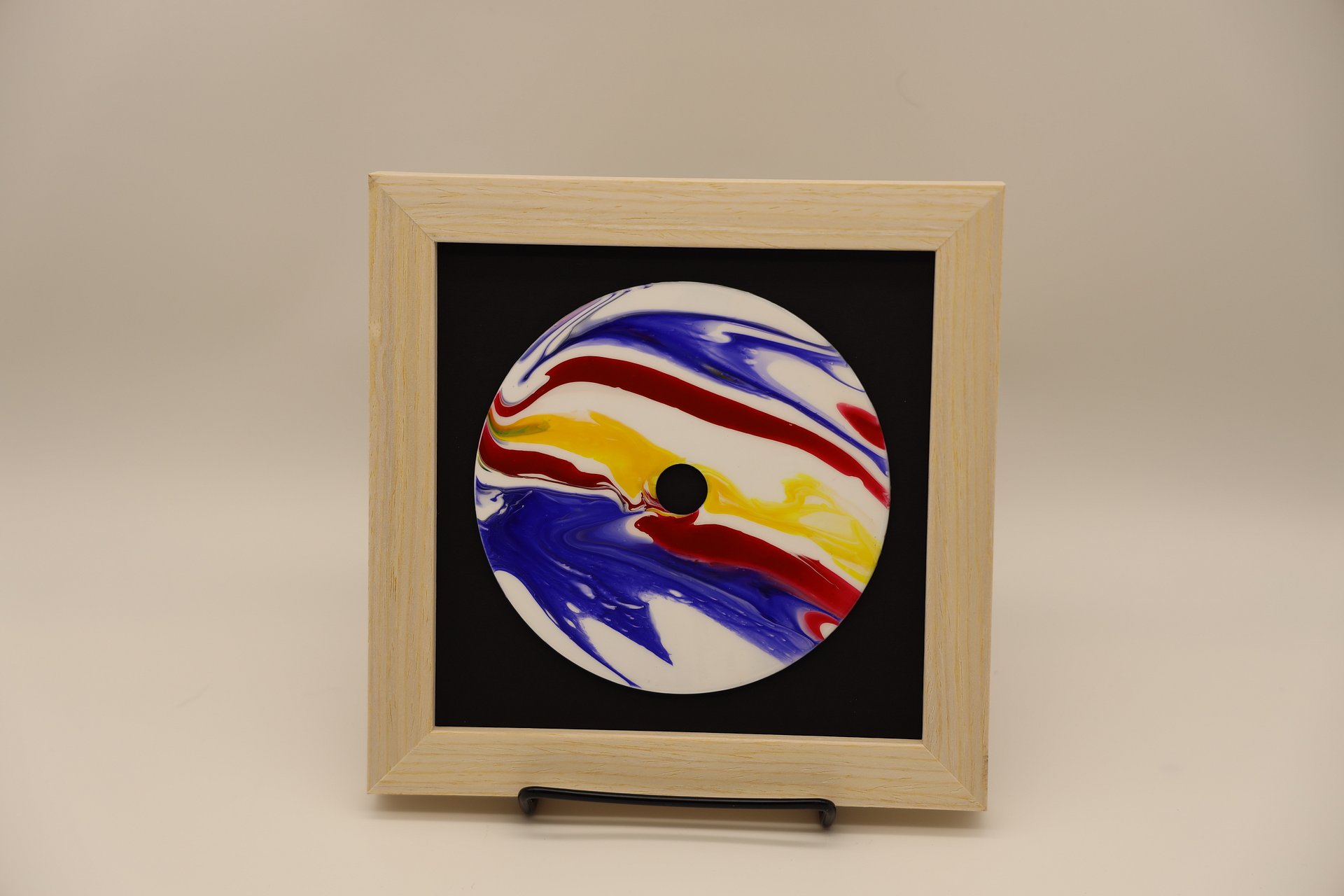 Framed Acrylic Pour Painting on CD - Blue, Yellow, and Red product image (1)