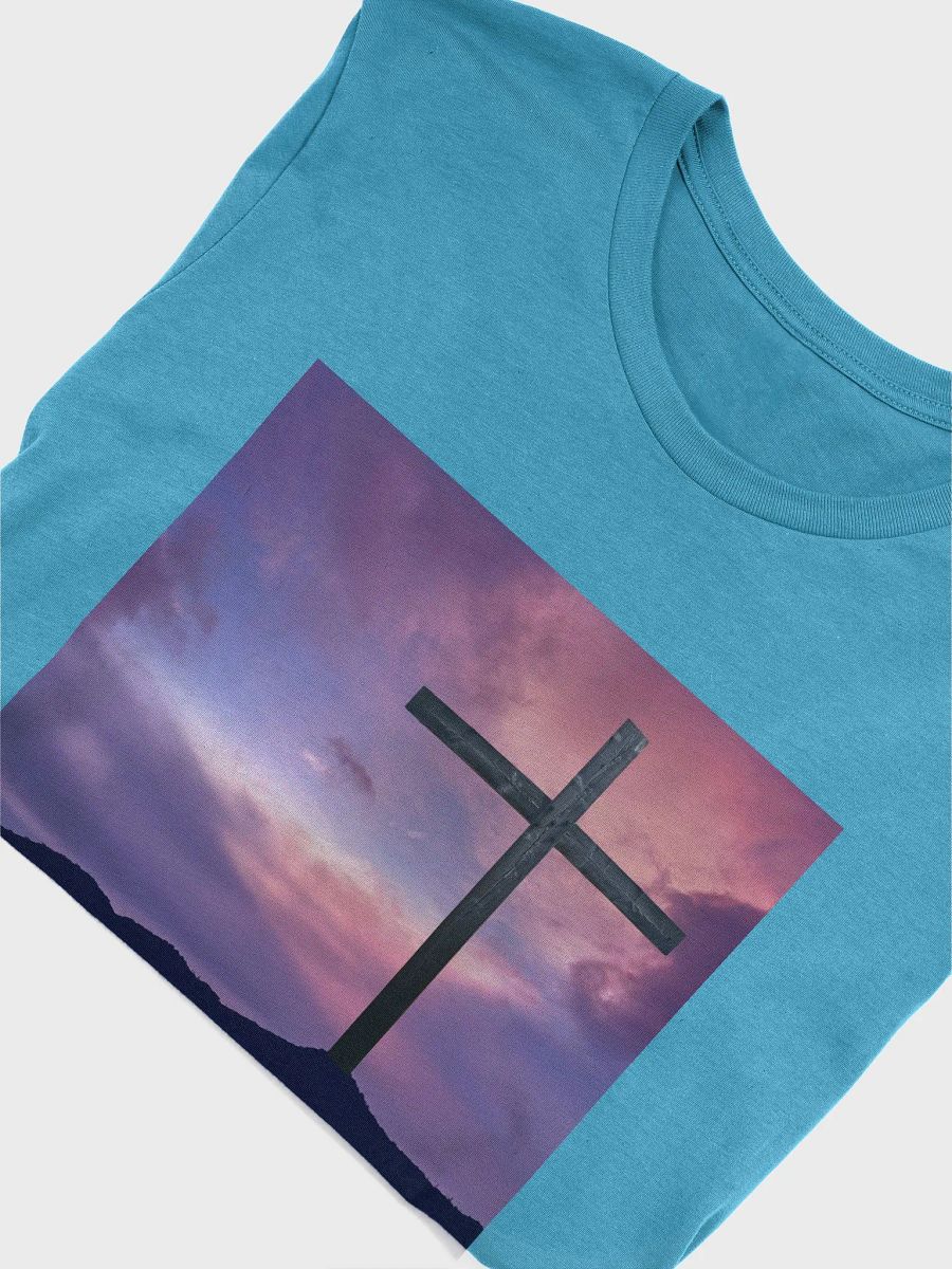 Wooden cross standing on a hill, silhouetted against a vibrant and colorful sky transitioning from deep purples to pinks t-shirt product image (4)