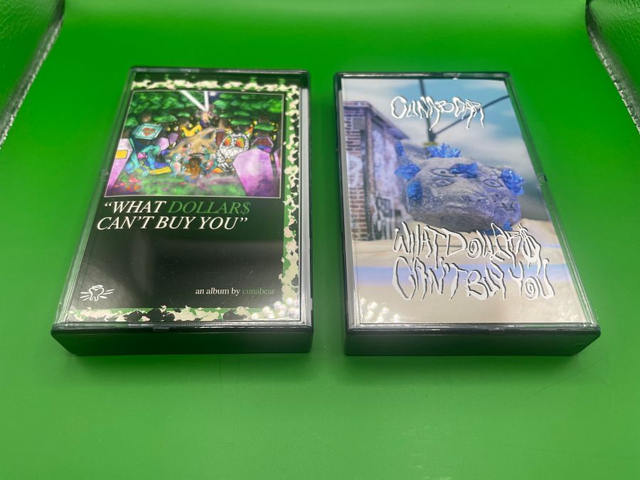 “Epitaph Stone” - “What Dollar$ Can’t Buy You” Standard Edition Cassette Tape product image (1)