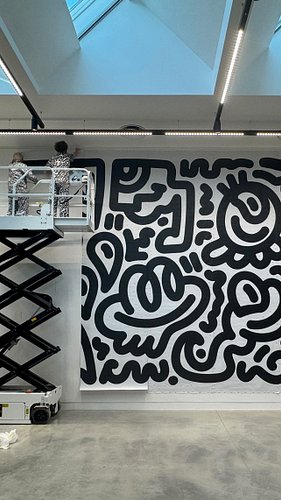 Covering a giant wall in my studio with vector doodles! Using Adobe Illustrator! Had to bring in my grandad to help me with t...